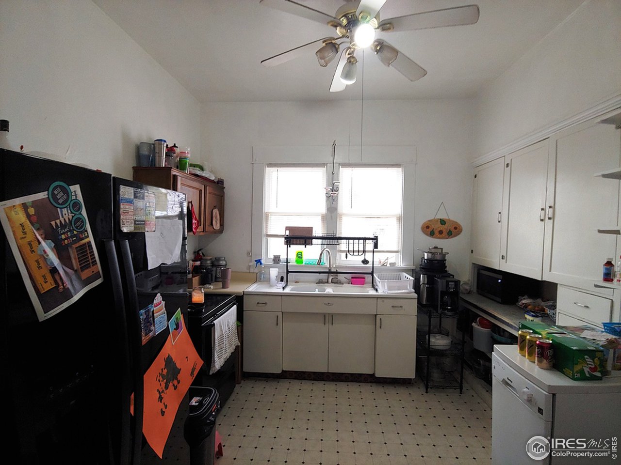324 Platte Street Sterling, CO 80751 - Photo 8 of 18 a kitchen that has a lot of cabinets and appliances