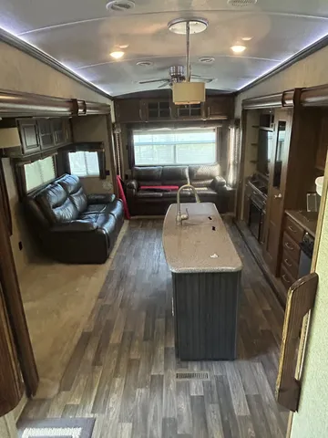 a kitchen with a refrigerator and a sink
