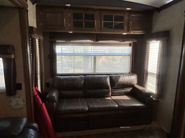 a room with cabinets and a fireplace