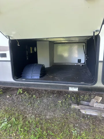 a bedroom with a bed and glass door