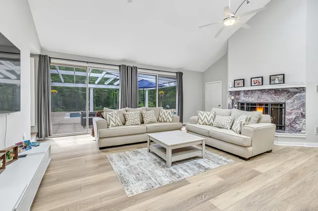 a living room with furniture and a fireplace