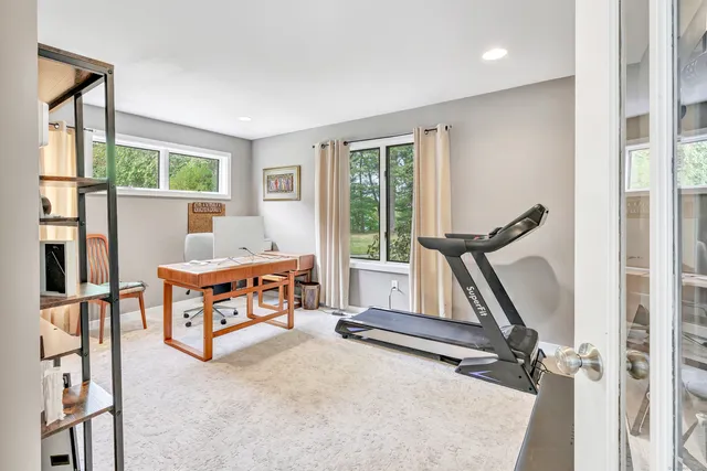 a view of room with window and air conditioner