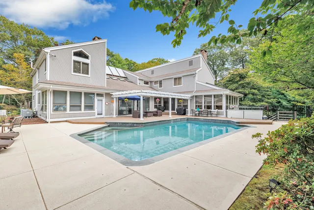 a front view of a house with swimming pool