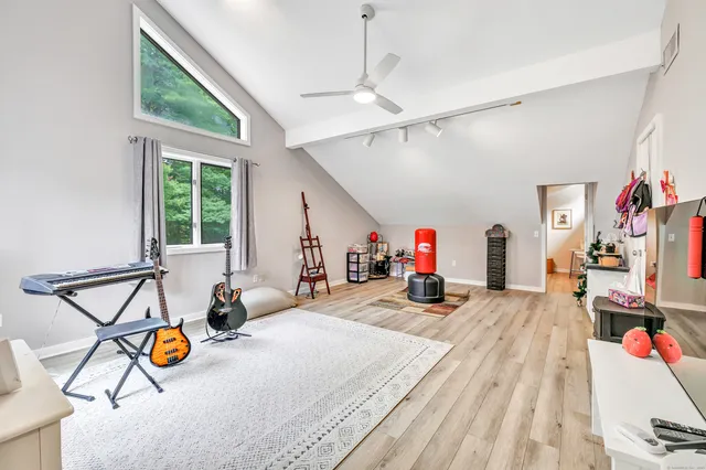 a spacious bathroom with a sink and a mirror