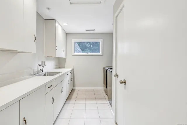 a view of a bedroom with wooden floor and windows