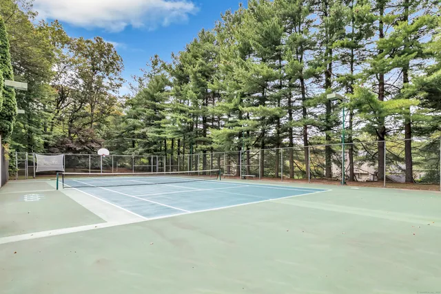 a view of a playground with basketball court