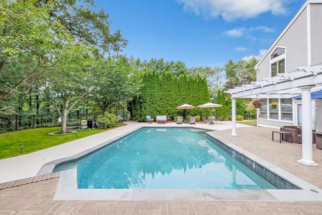 a view of a swimming pool with a garden