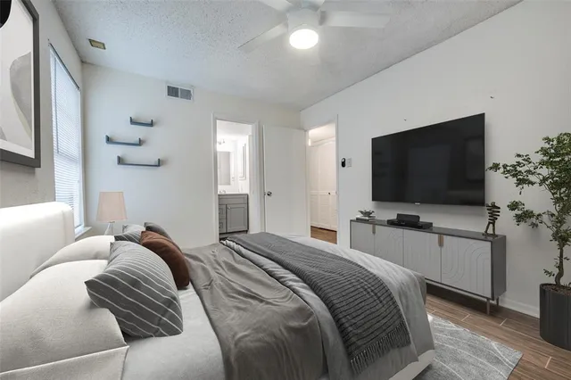 a hotel room with a television and a bed