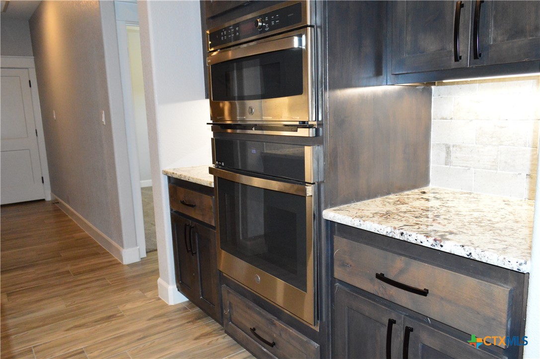 1026 County Road 3152 Kempner, TX 76539 - Photo 10 of 48 The brightly lit kitchen has recessed lighting, pendant lighting, and under-cabinet lighting.