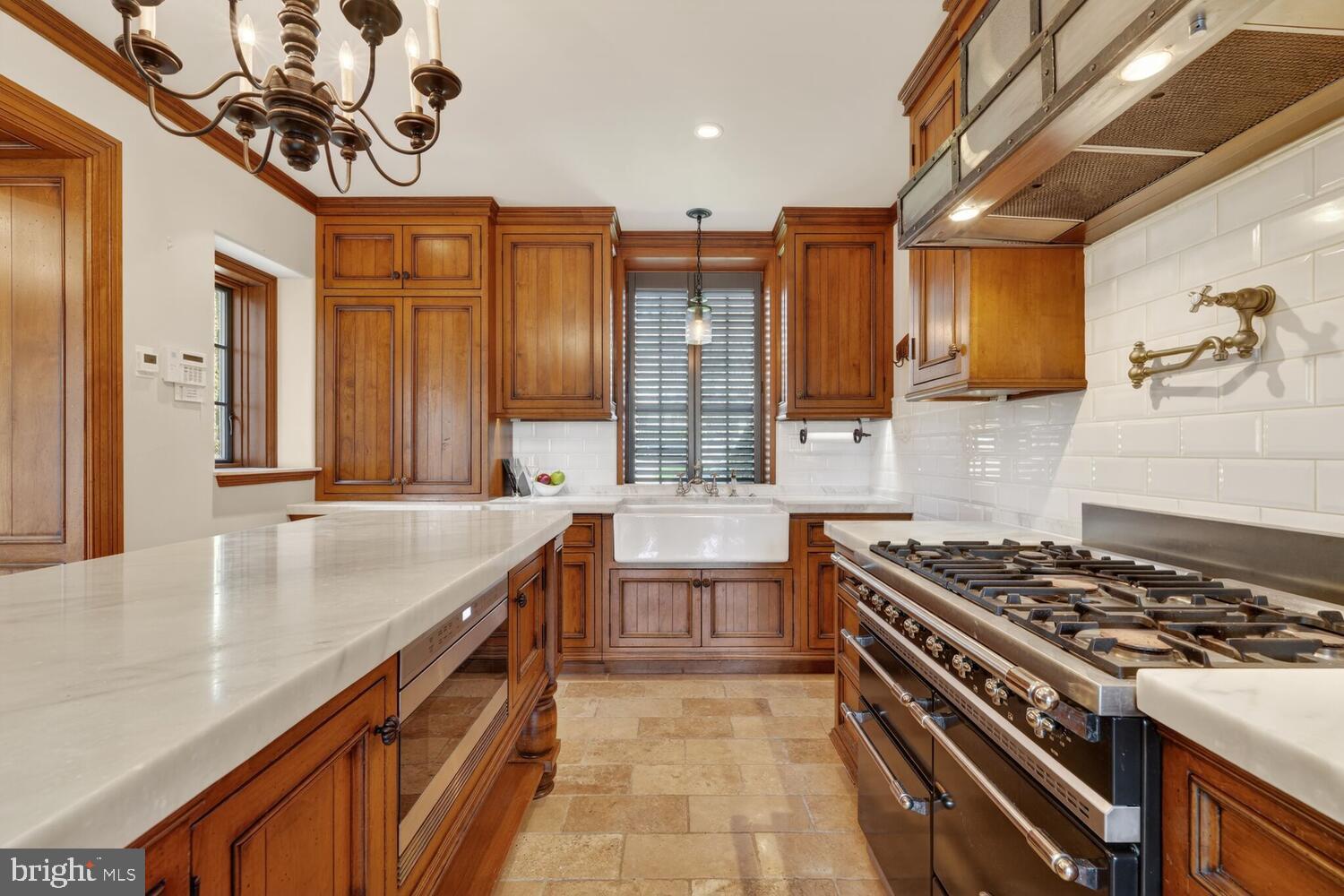 2604 31st Street Northwest Washington, DC 20008 - Photo 13 of 46 a kitchen with stainless steel appliances granite countertop a stove a sink and a refrigerator