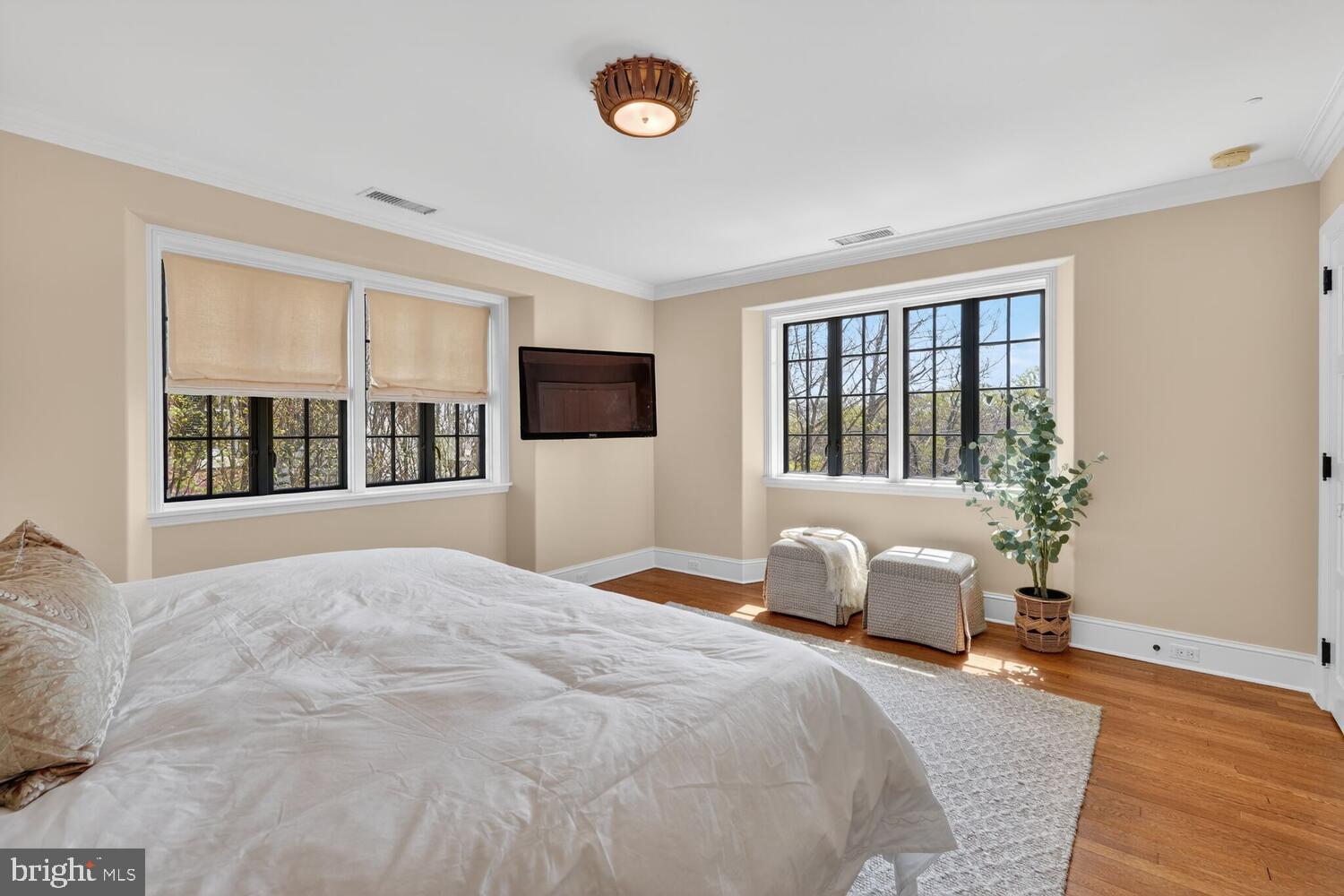 2604 31st Street Northwest Washington, DC 20008 - Photo 19 of 46 a bedroom with a bed and a large window