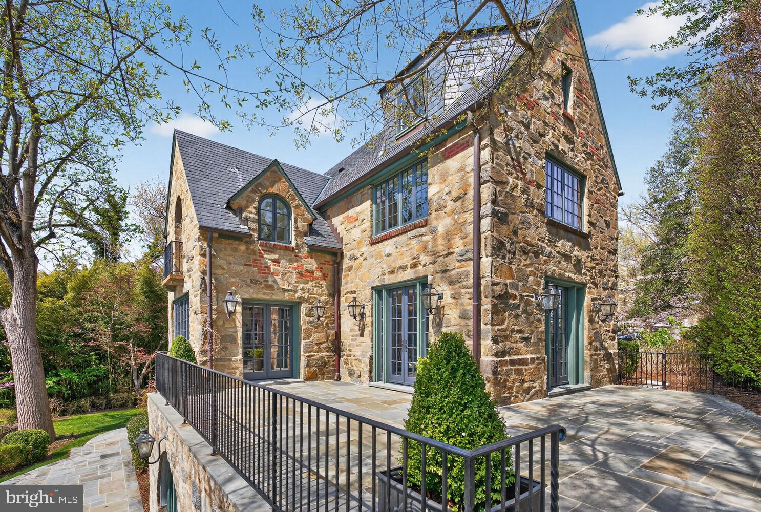 2604 31st Street Northwest Washington, DC 20008 - Photo 44 of 46 a view of a brick house with large windows and a table