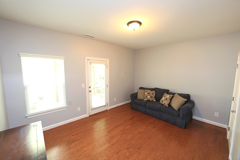 8734 Cypress Grove Run Raleigh, NC 27612 - Photo 25 of 30 The main floor bonus provides an extra space for entertaining. There is a powder room and door to the patio under the deck. Bonus Room