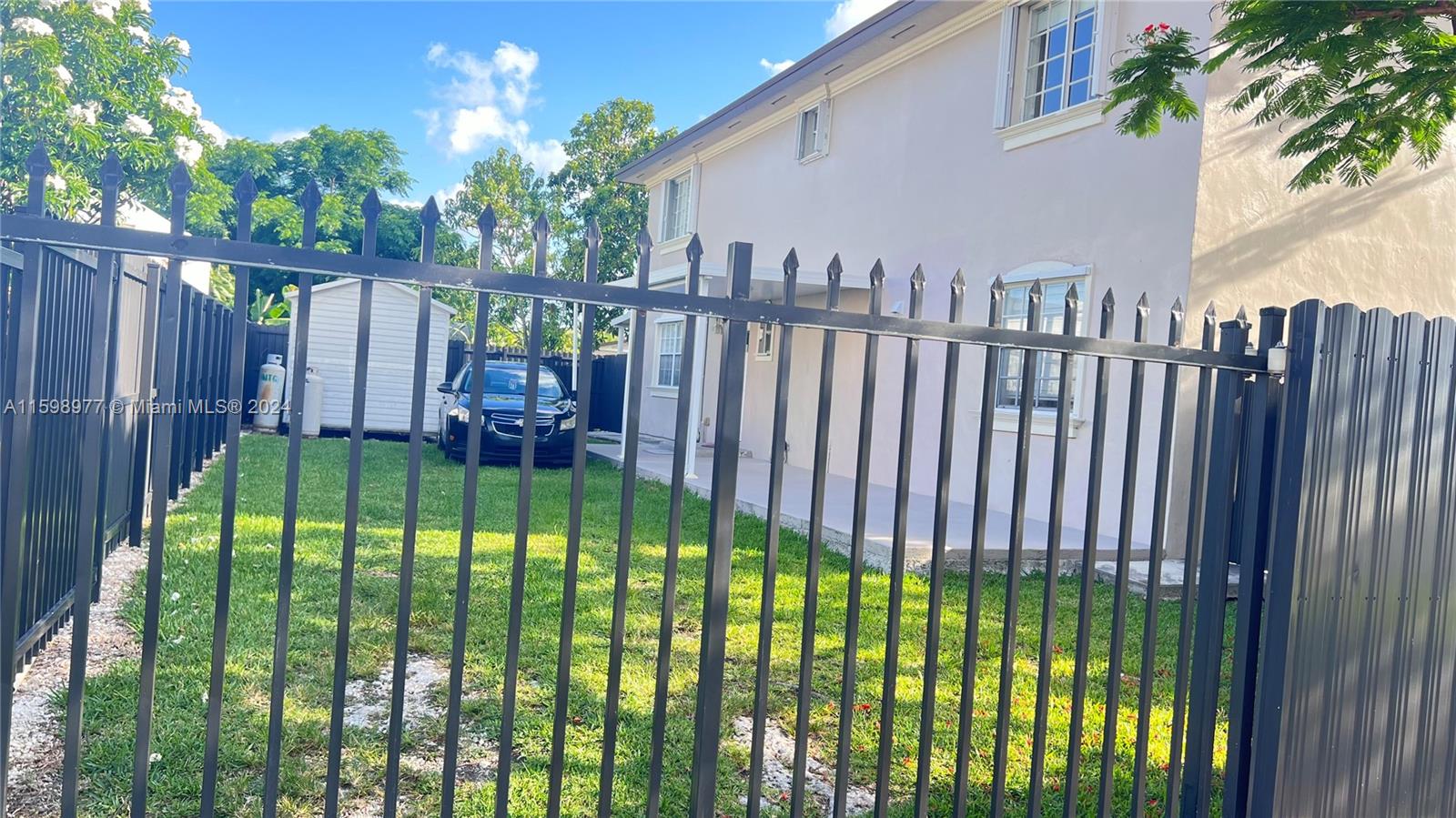 30701 Southwest 150th Avenue, Unit C Homestead, FL 33033 - Photo 2 of 30 a view of a backyard with a garden