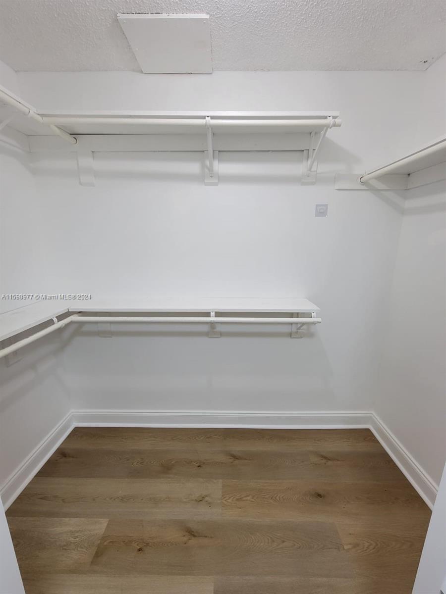 30701 Southwest 150th Avenue, Unit C Homestead, FL 33033 - Photo 22 of 30 a view of an empty walk in closet