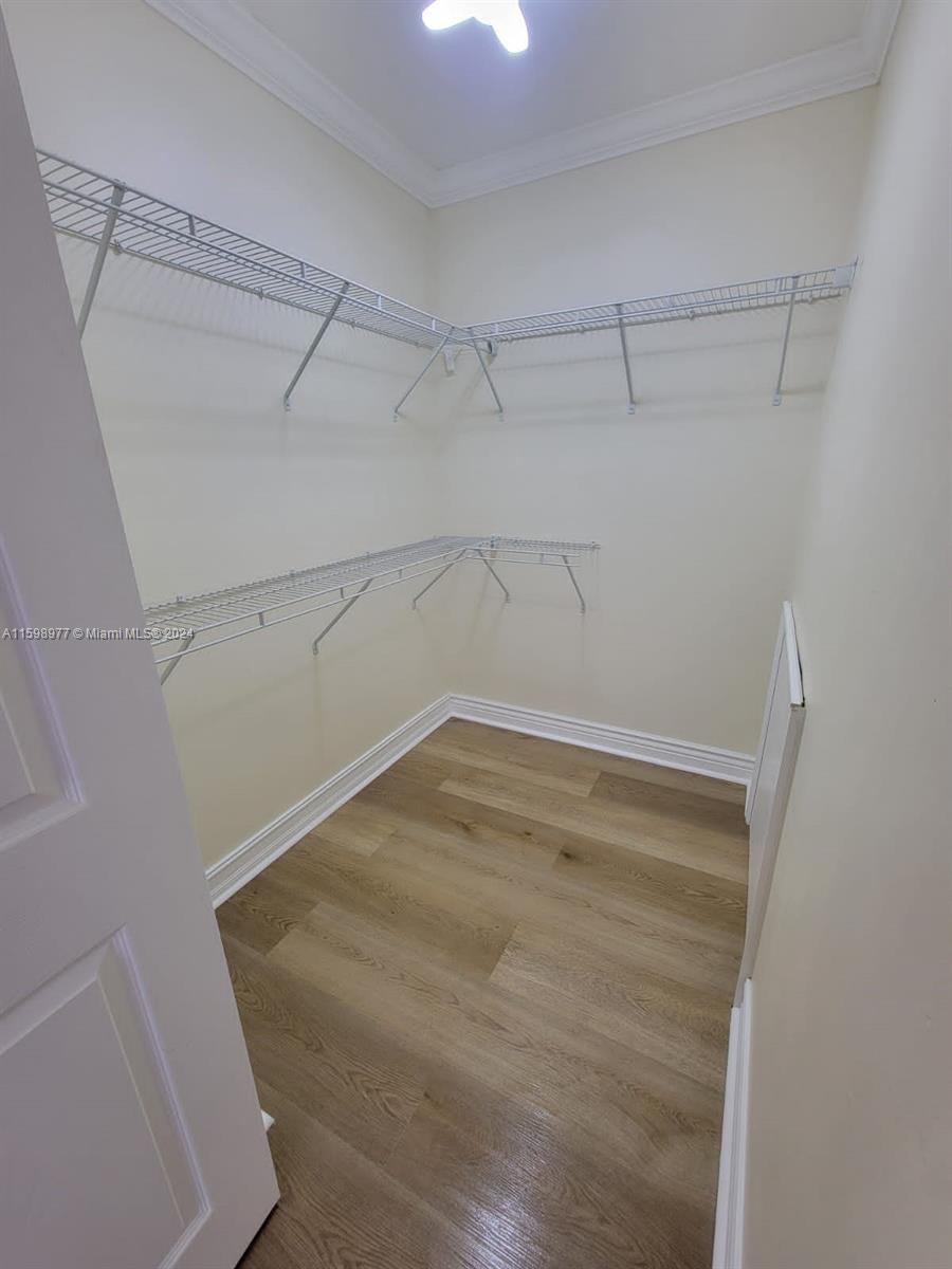 30701 Southwest 150th Avenue, Unit C Homestead, FL 33033 - Photo 23 of 30 a view of a room with racks on the wall