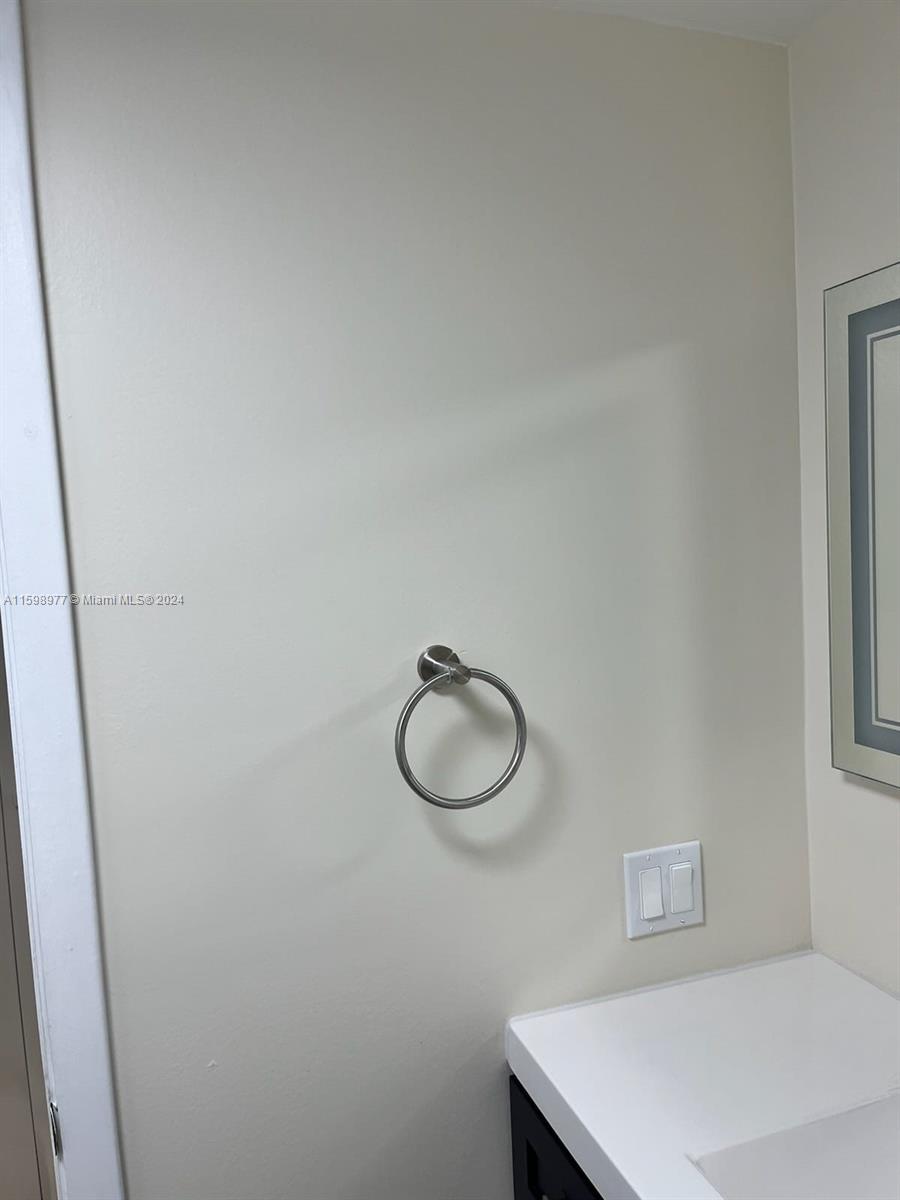30701 Southwest 150th Avenue, Unit C Homestead, FL 33033 - Photo 26 of 30 a bathroom with a sink and a mirror