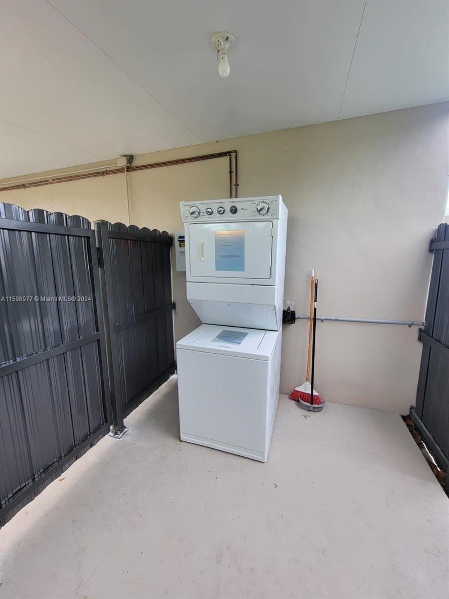 30701 Southwest 150th Avenue, Unit C Homestead, FL 33033 - Photo 29 of 30 a utility room with dryer and washer