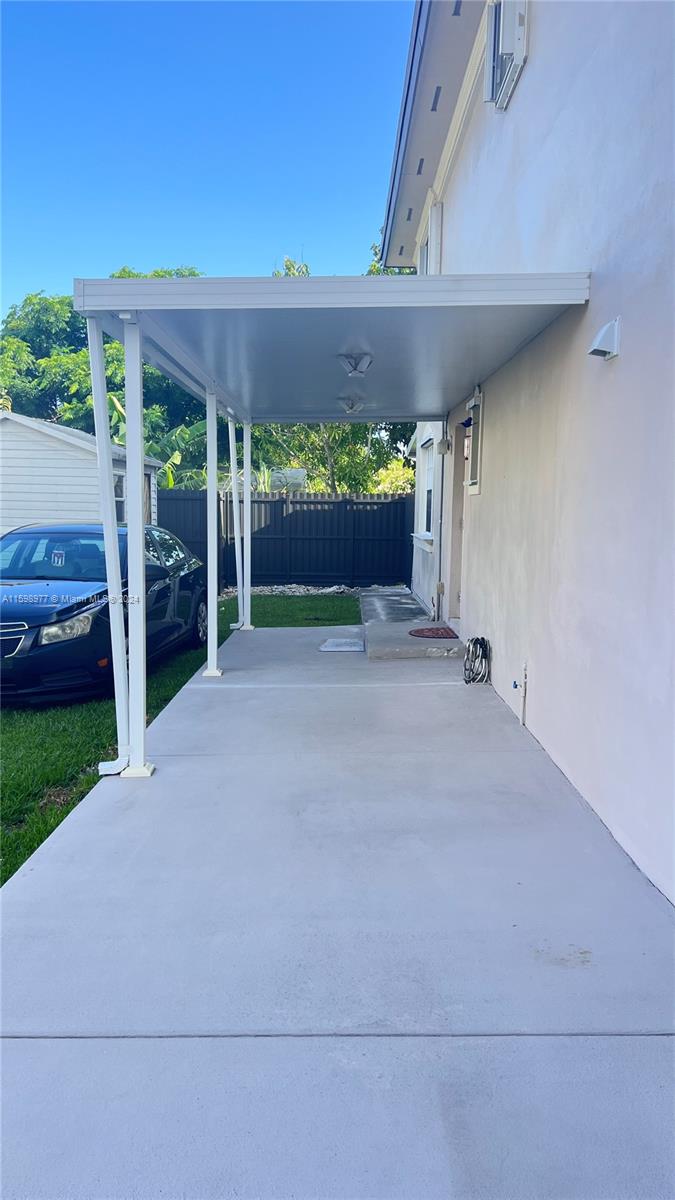 30701 Southwest 150th Avenue, Unit C Homestead, FL 33033 - Photo 6 of 30 a view of a porch