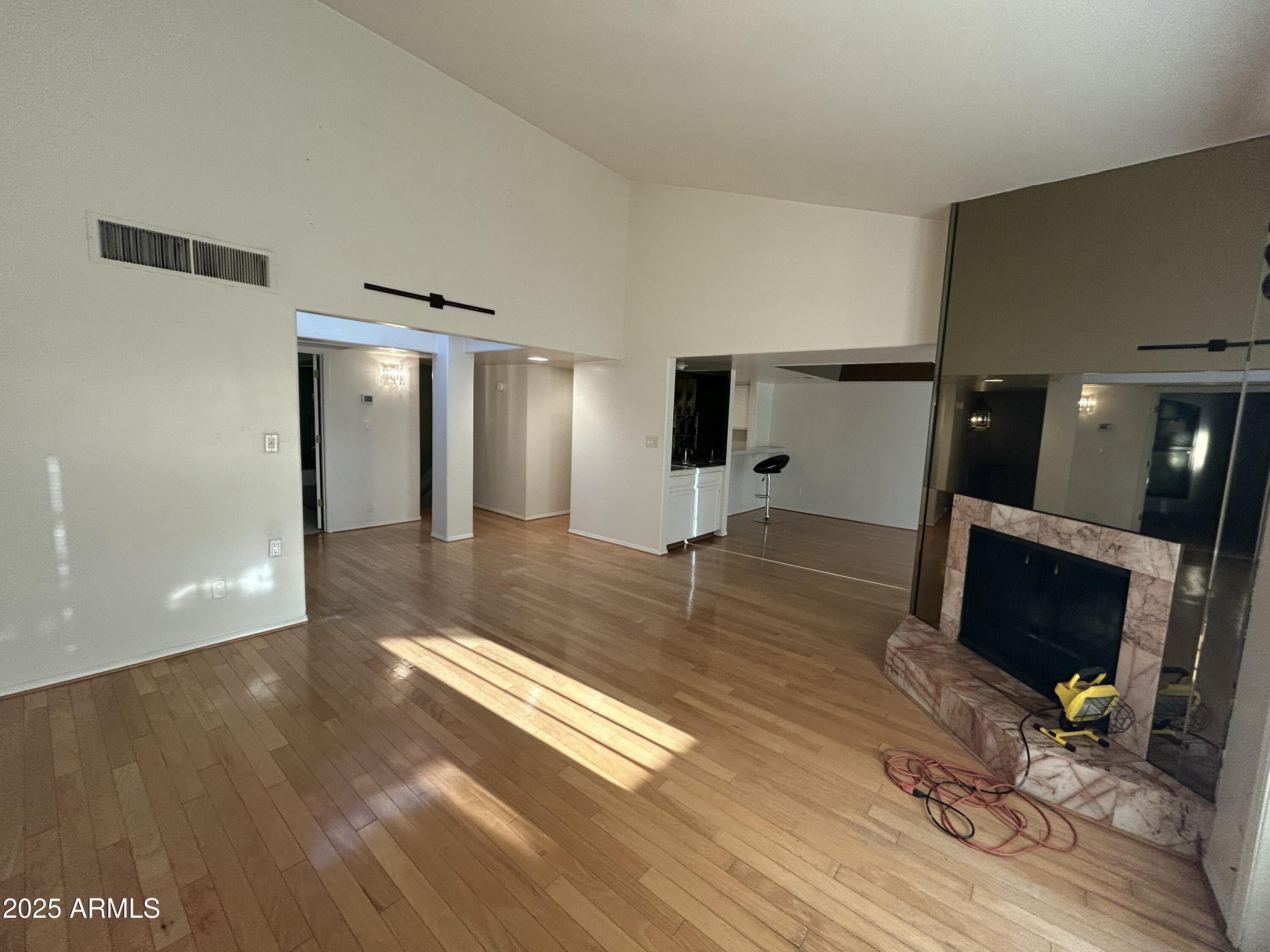 5736 North 25th Street Phoenix, AZ 85016 - Photo 6 of 24 a living room with furniture flat screen tv and a fireplace