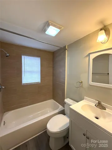 a bathroom with a sink toilet and bathtub