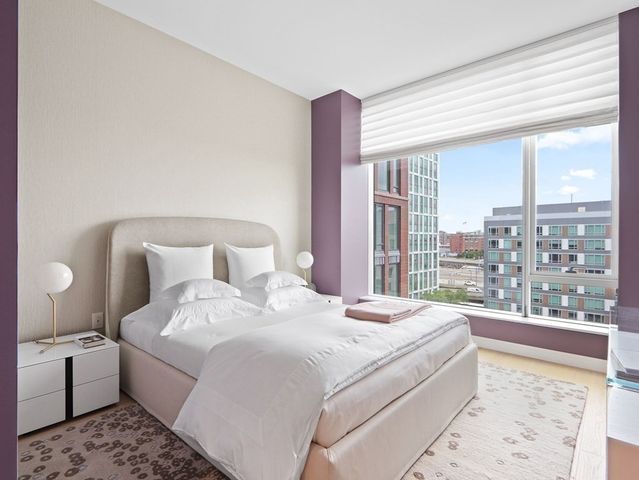 a utility room with a sink and a mirror