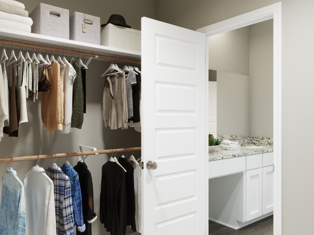13610 Kit Run Splendora, TX 77372 - Photo 28 of 40 a view of walk in closet with clothes and shoes
