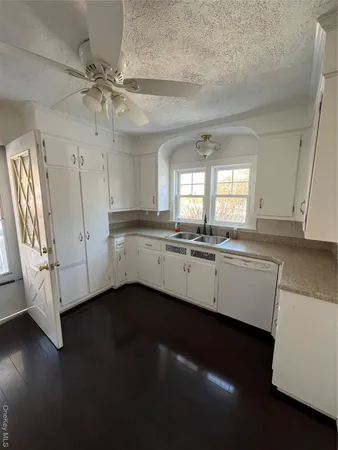 a view of a kitchen with electric appliances