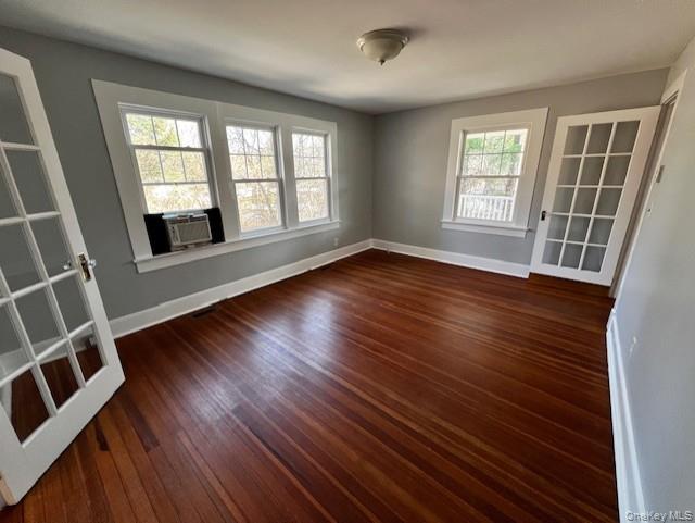 26 Pump House Road Cortlandt Manor, NY 10567 - Photo 4 of 19 an empty room with wooden floor and windows