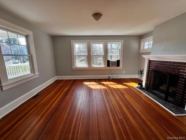 26 Pump House Road Cortlandt Manor, NY 10567 - Photo 6 of 19 a view of empty room with wooden floor and fireplace