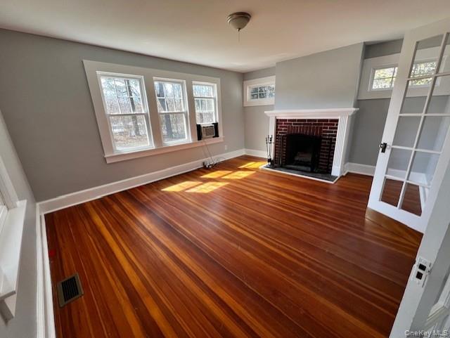 26 Pump House Road Cortlandt Manor, NY 10567 - Photo 7 of 19 a view of an empty room with wooden floor fireplace and a window