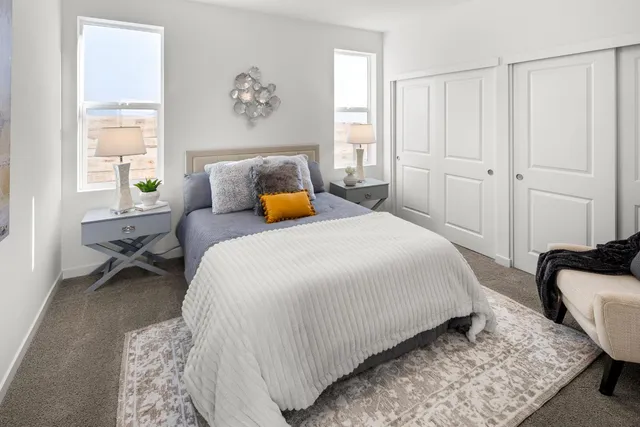 a bedroom with bed and a window