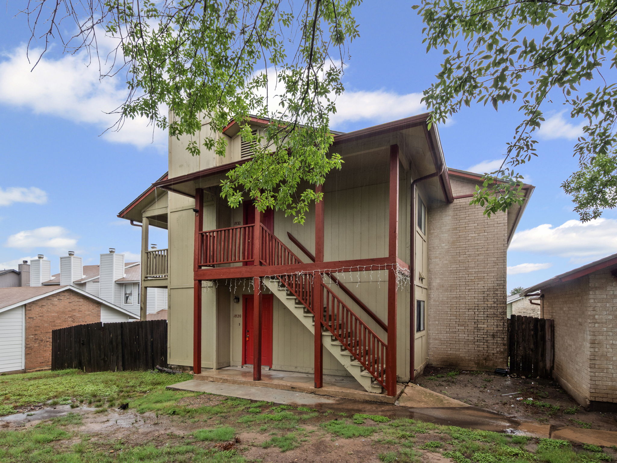 1816 Rawhide Loop, Unit 1822 Round Rock, TX 78681 - Photo 17 of 17 Back of property featuring stairway