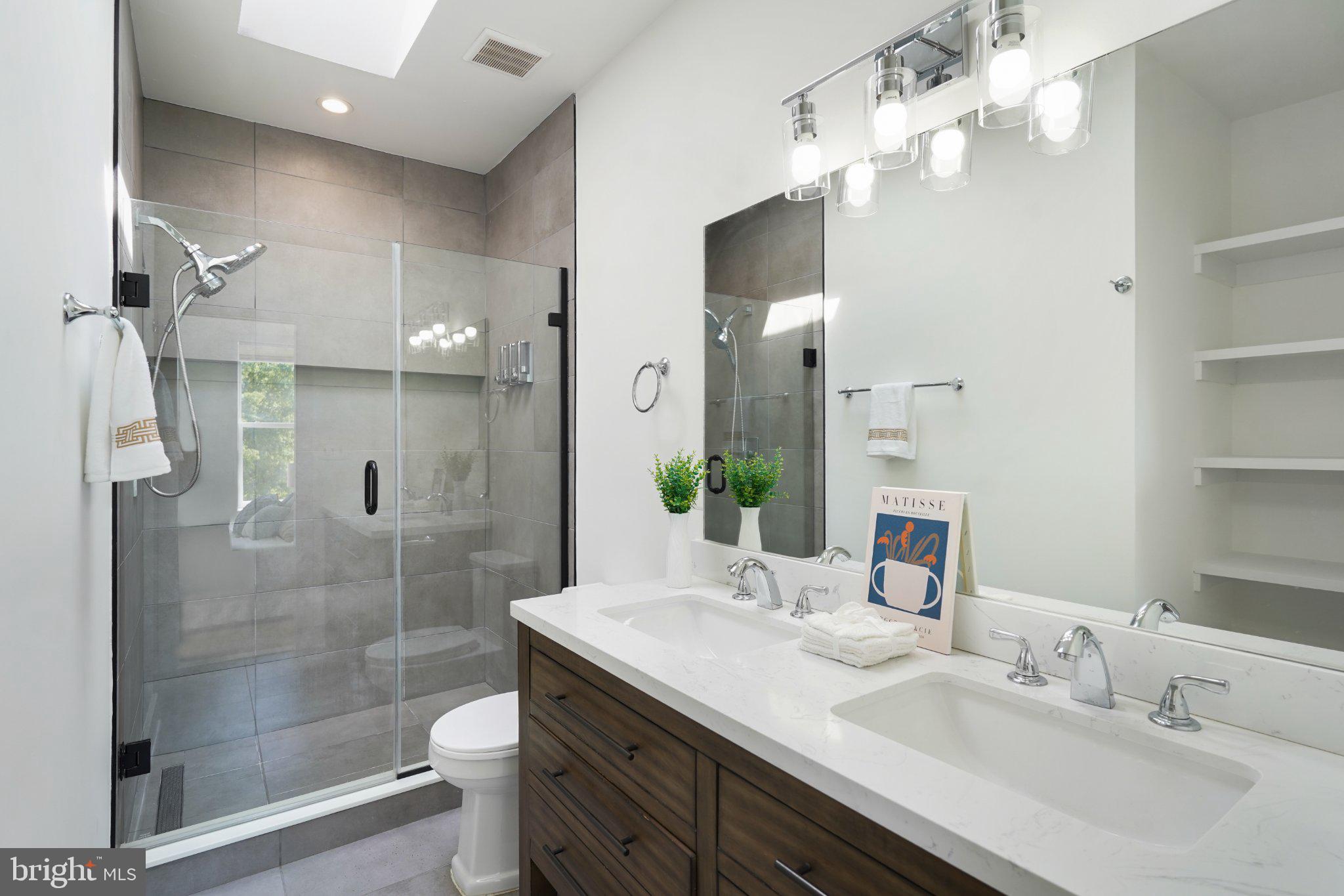 112 V Street Northeast Washington, DC 20002 - Photo 24 of 25 a bathroom with a sink a toilet and shower