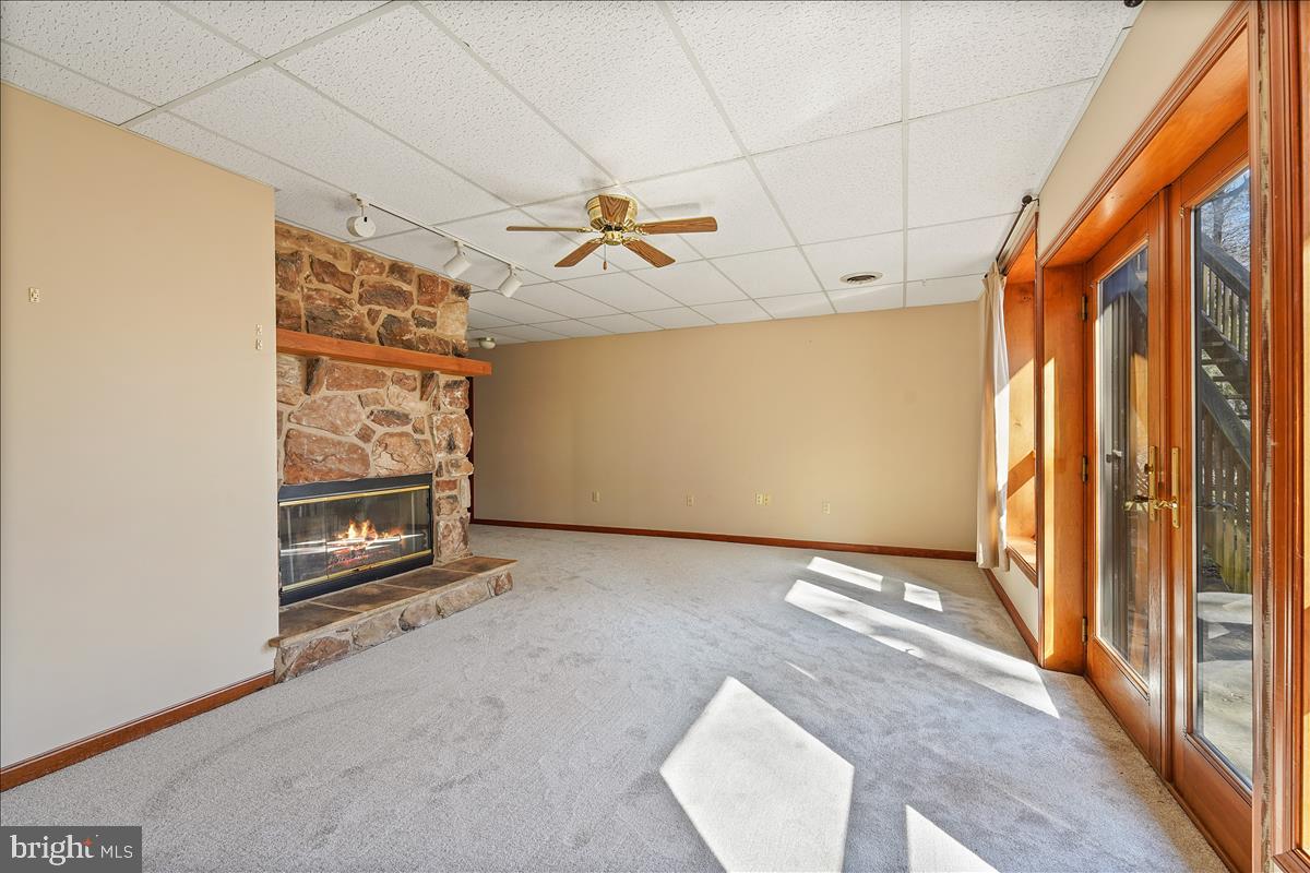 255 Brown Road Nottingham, PA 19362 - Photo 34 of 38 Downstairs fireplace