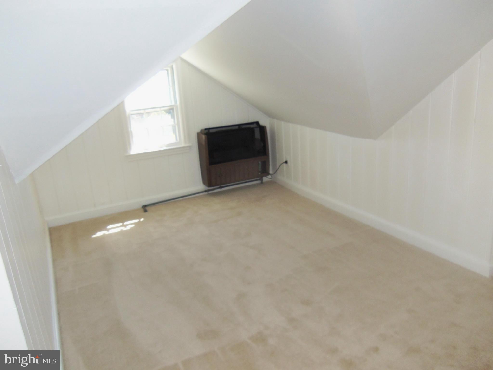 10148 Sutherland Road Silver Spring, MD 20901 - Photo 18 of 30 a view of an empty room with a window