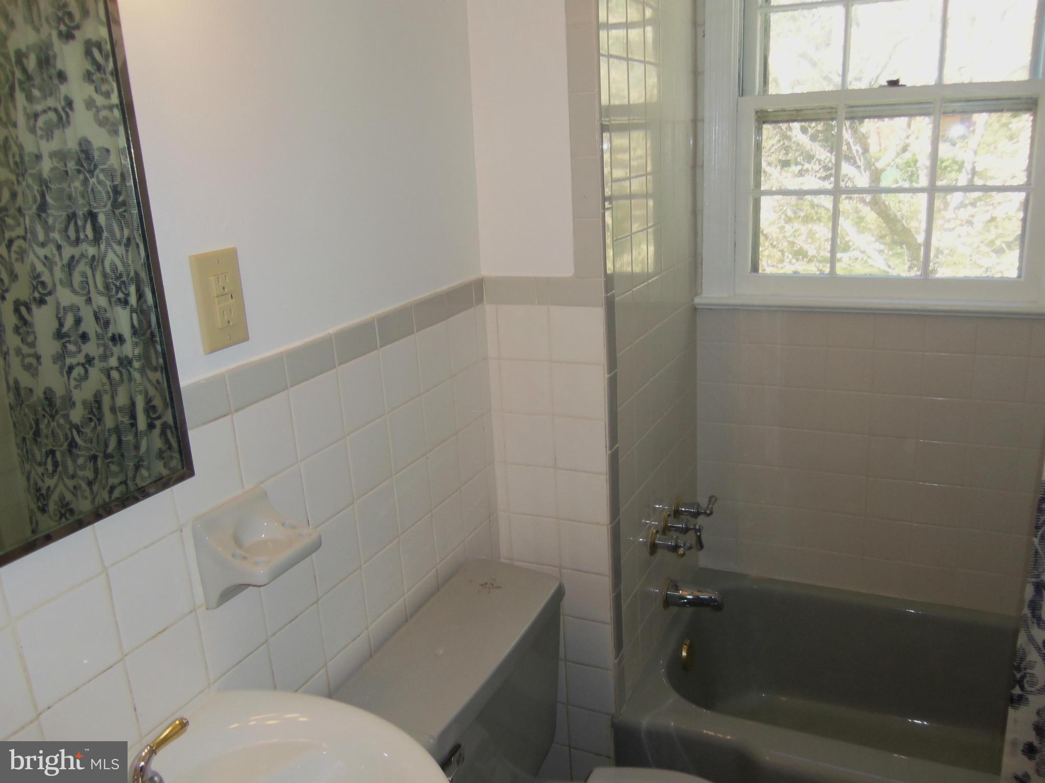 10148 Sutherland Road Silver Spring, MD 20901 - Photo 21 of 30 a bathroom with a toilet and a shower