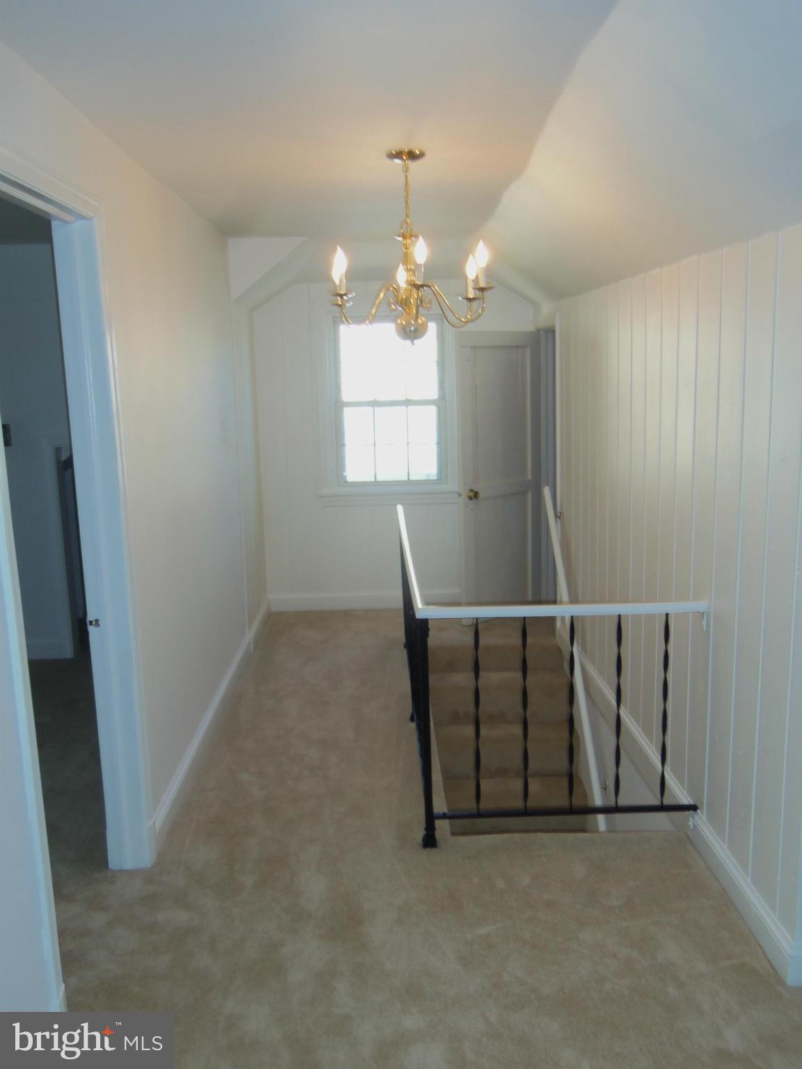 10148 Sutherland Road Silver Spring, MD 20901 - Photo 25 of 30 wooden floor in an empty room with a window