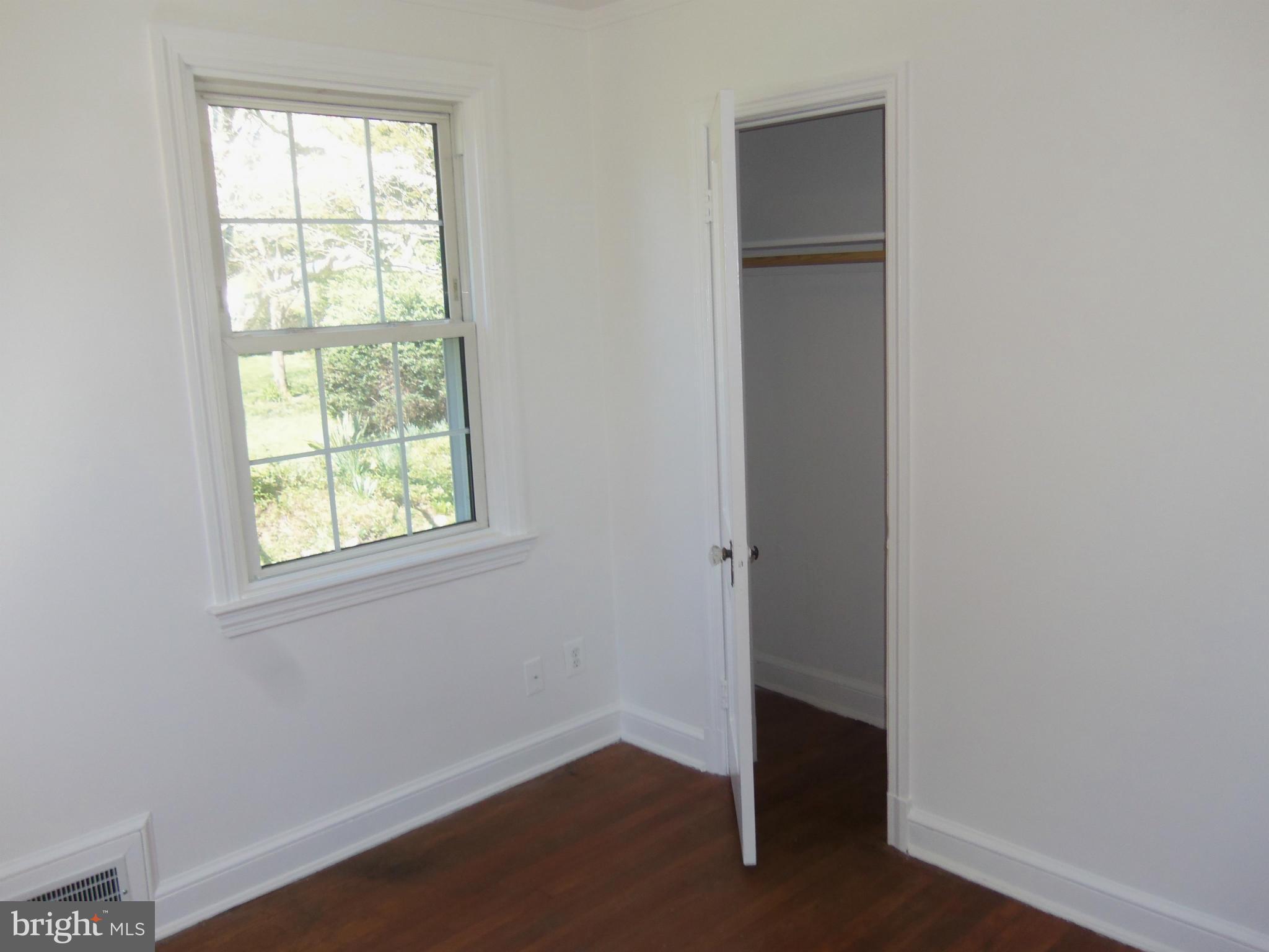 10148 Sutherland Road Silver Spring, MD 20901 - Photo 9 of 30 an empty room with a window