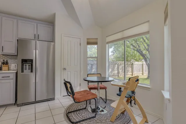 a work room with furniture and a window