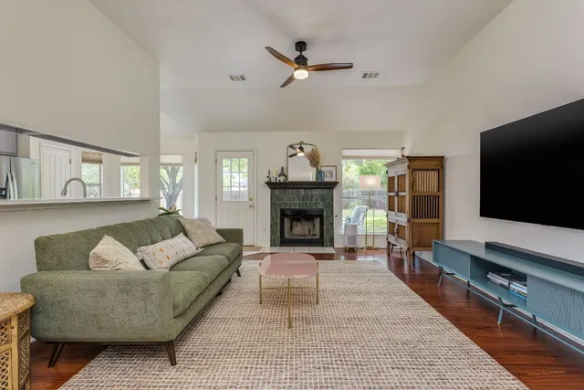 a living room with furniture and a fireplace