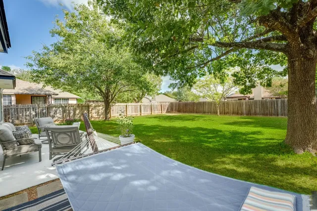 a view of a house with backyard porch and patio