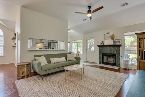 a living room with furniture and a fireplace