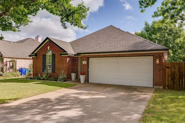 a backyard of a house with lots of green space and garden