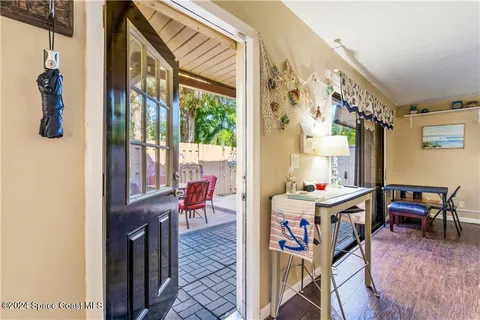 a room with furniture a rug and a window