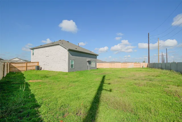 a view of a backyard with a garden and plants