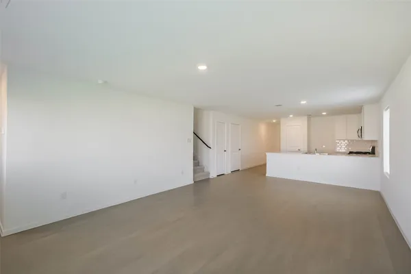 a view of a kitchen with a sink and a window