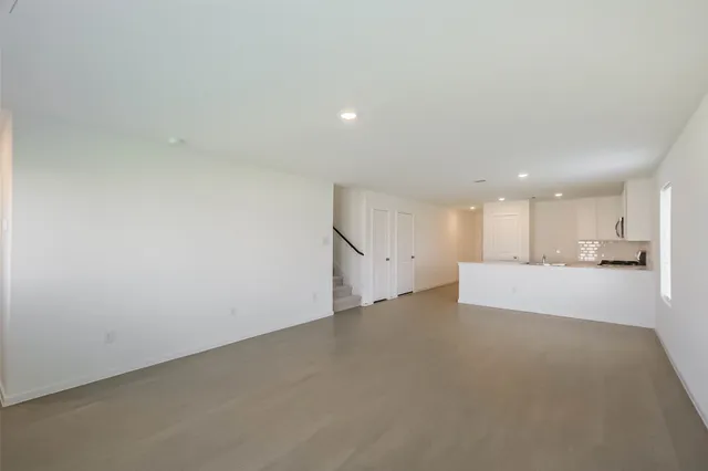 a view of a kitchen with a sink and a window