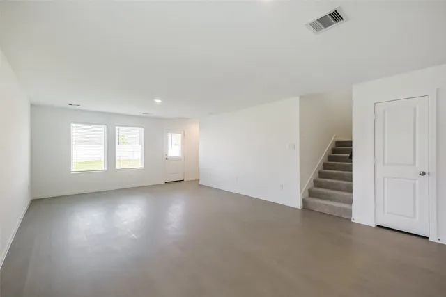 an empty room with windows