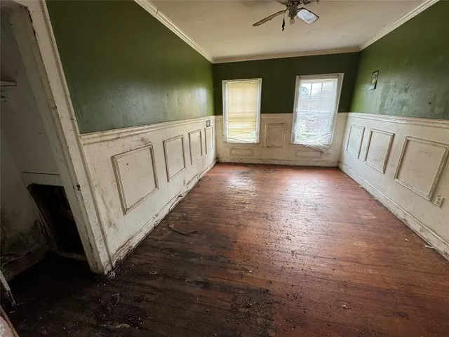 a view of a hallway with stairs